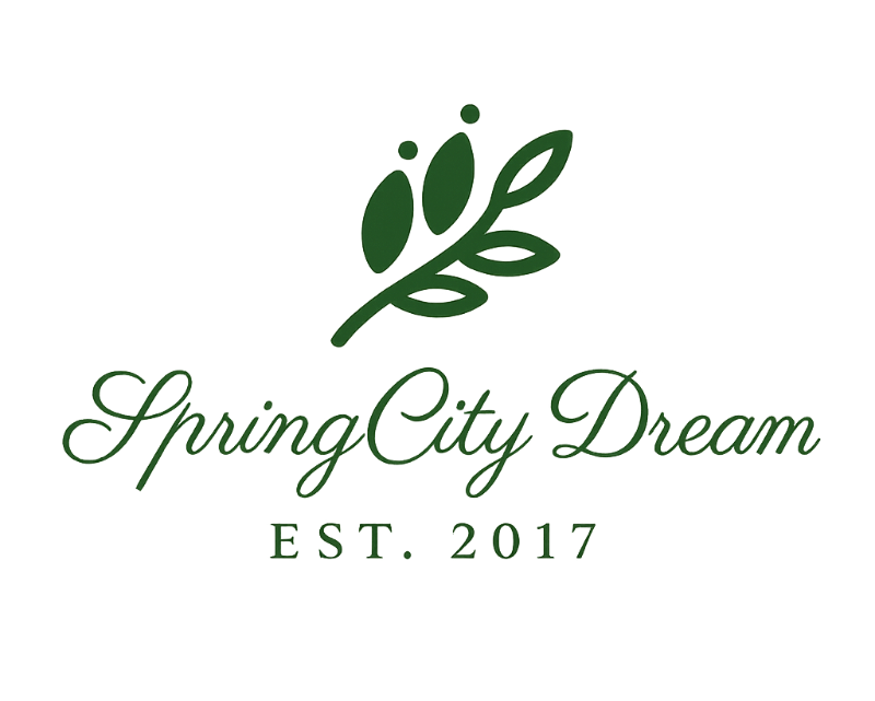 Logo for 'Spring City Dream' with a green leaf design on a white background