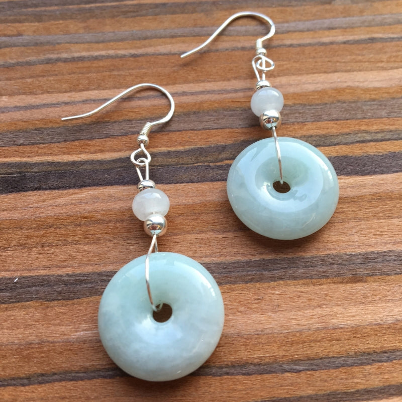 Side view of Chinese-style jade earrings with sage green round stone and silver hook