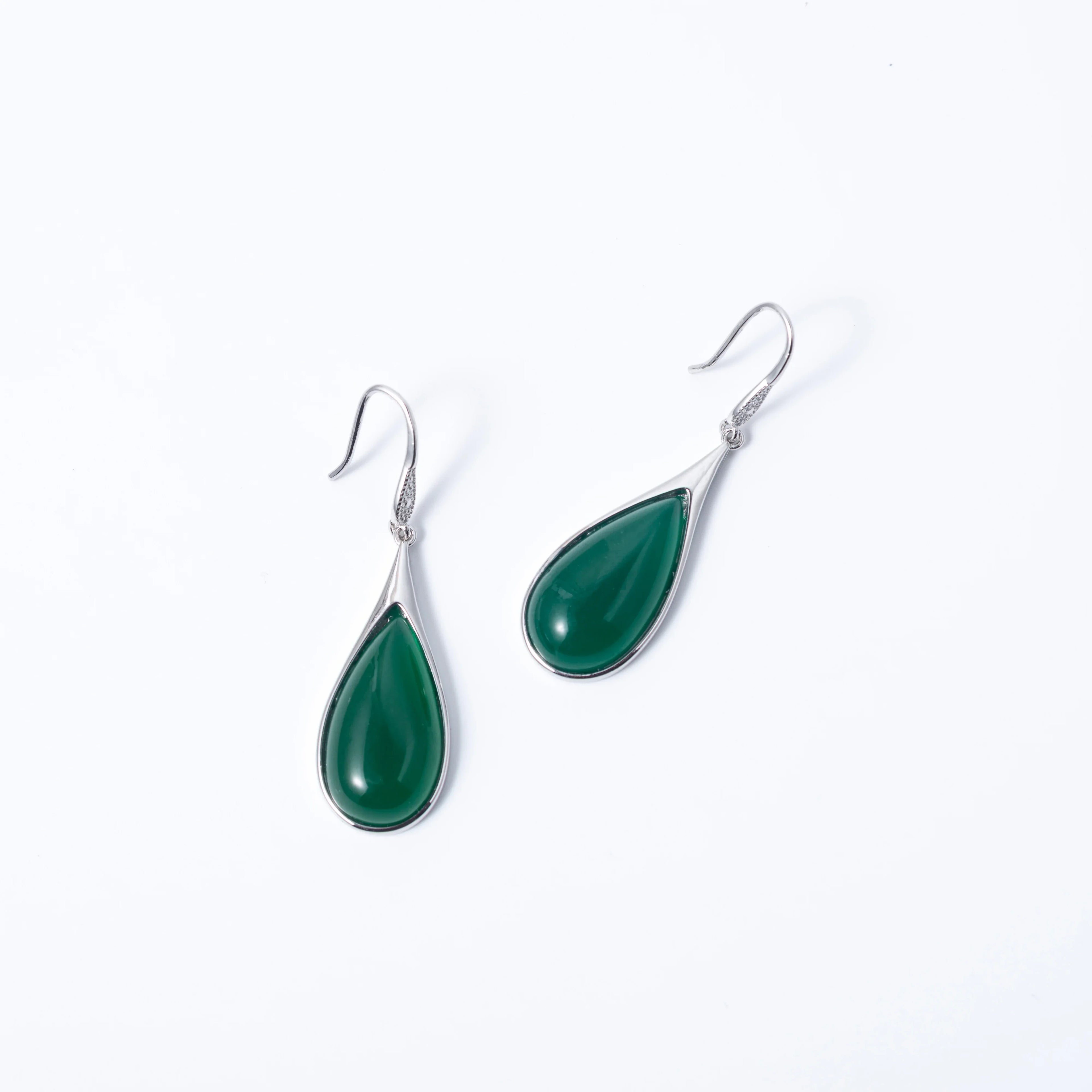 Vintage-style Chinese jade earrings in deep green with silver teardrop setting