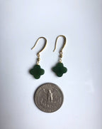 Clover jade earrings shown next to coin to display leaf charm size

