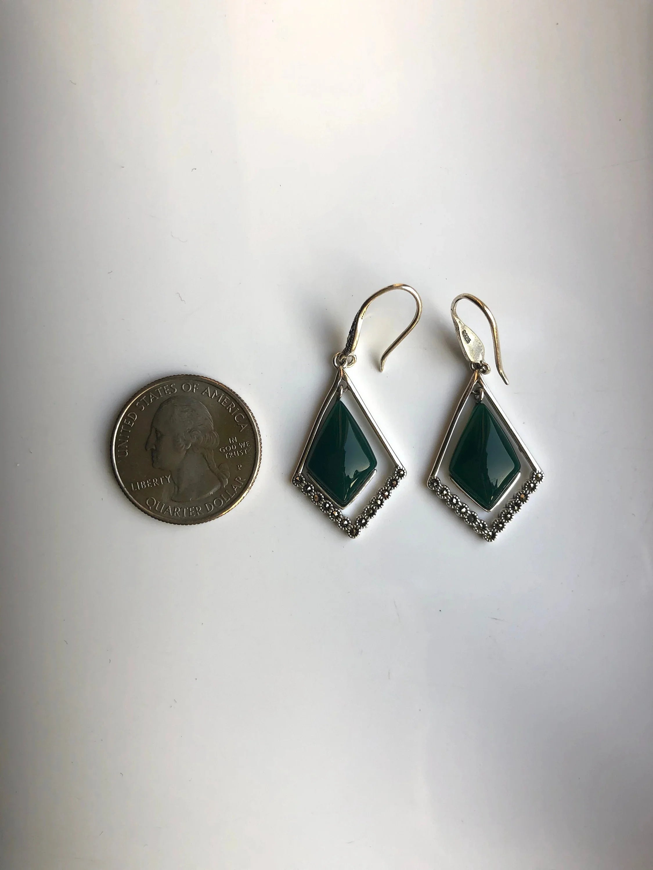 Back of rhombus jade earrings showing silver hoop attachment and natural jade finish