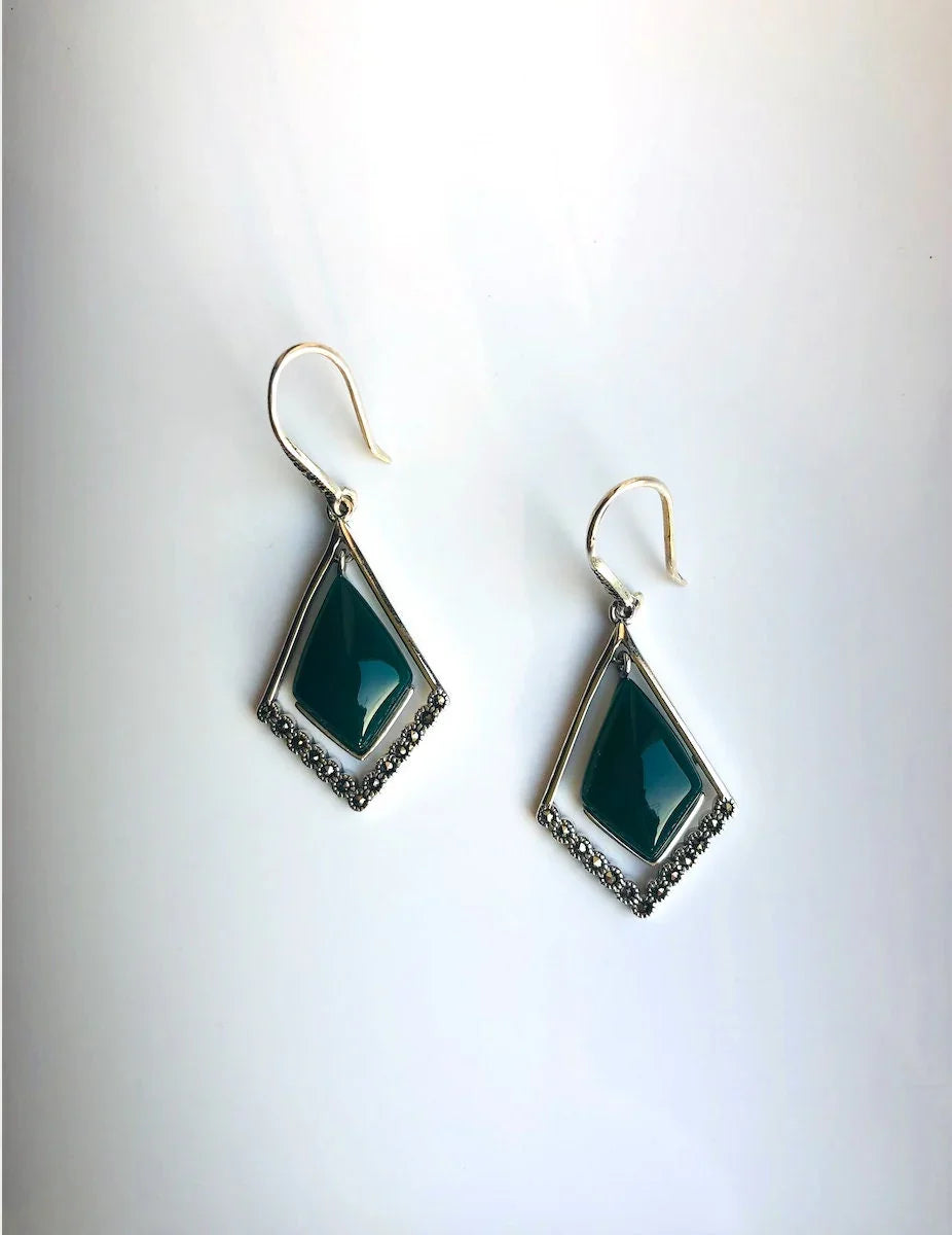 Front view of dark green diamond-shaped jade earrings with sterling silver hoops