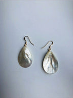 front and back Teardrop-shaped earrings on a light gray background
