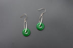 Front view of green jade donut earrings with sterling silver hooks and polished finish