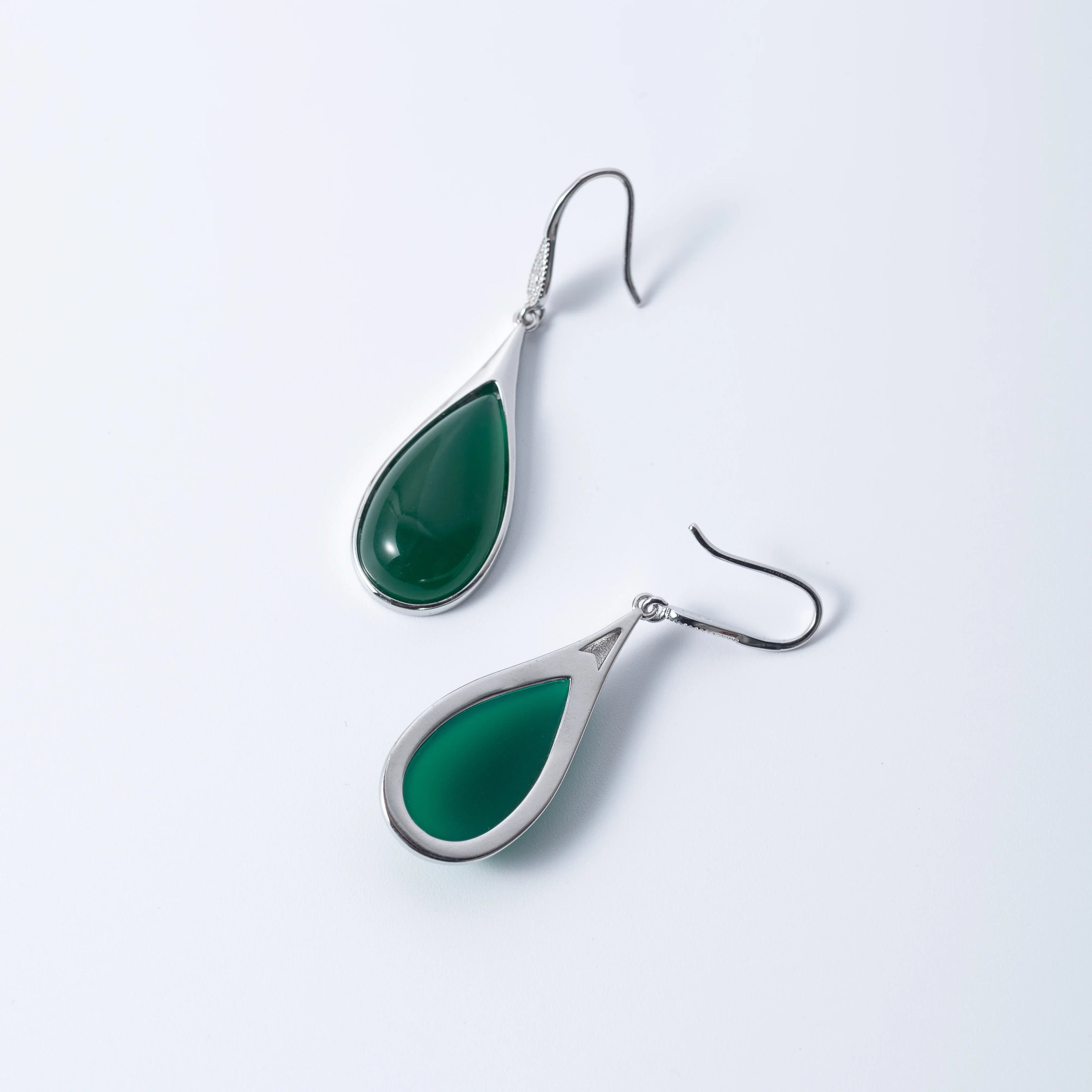 Front and back side of Green jade earrings in teardrop shape, ideal for gifting