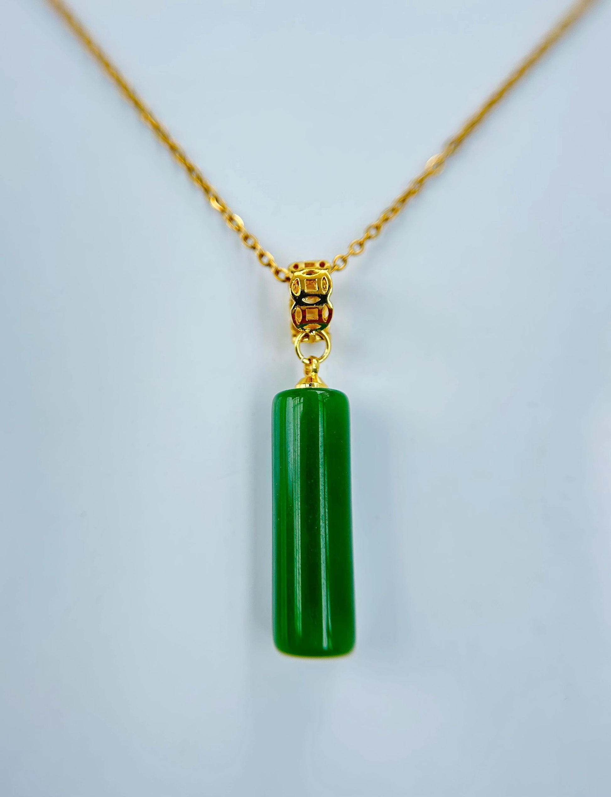 18 inch green jade pillar necklace with gold chain, front view of simple minimalist design