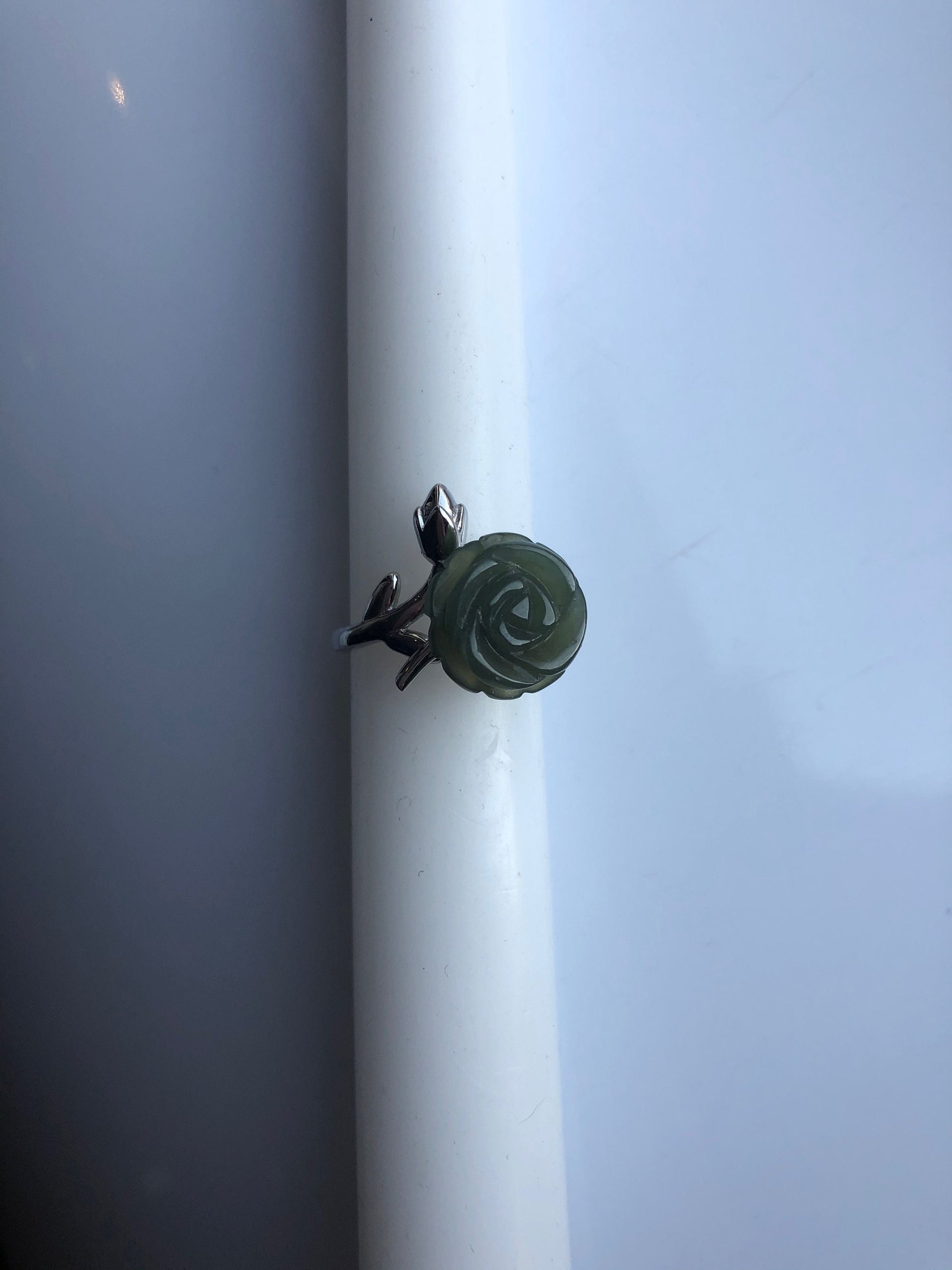 Green jade rose ring with silver leaf band – front view