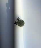 Green jade rose ring with silver leaf band – front view
