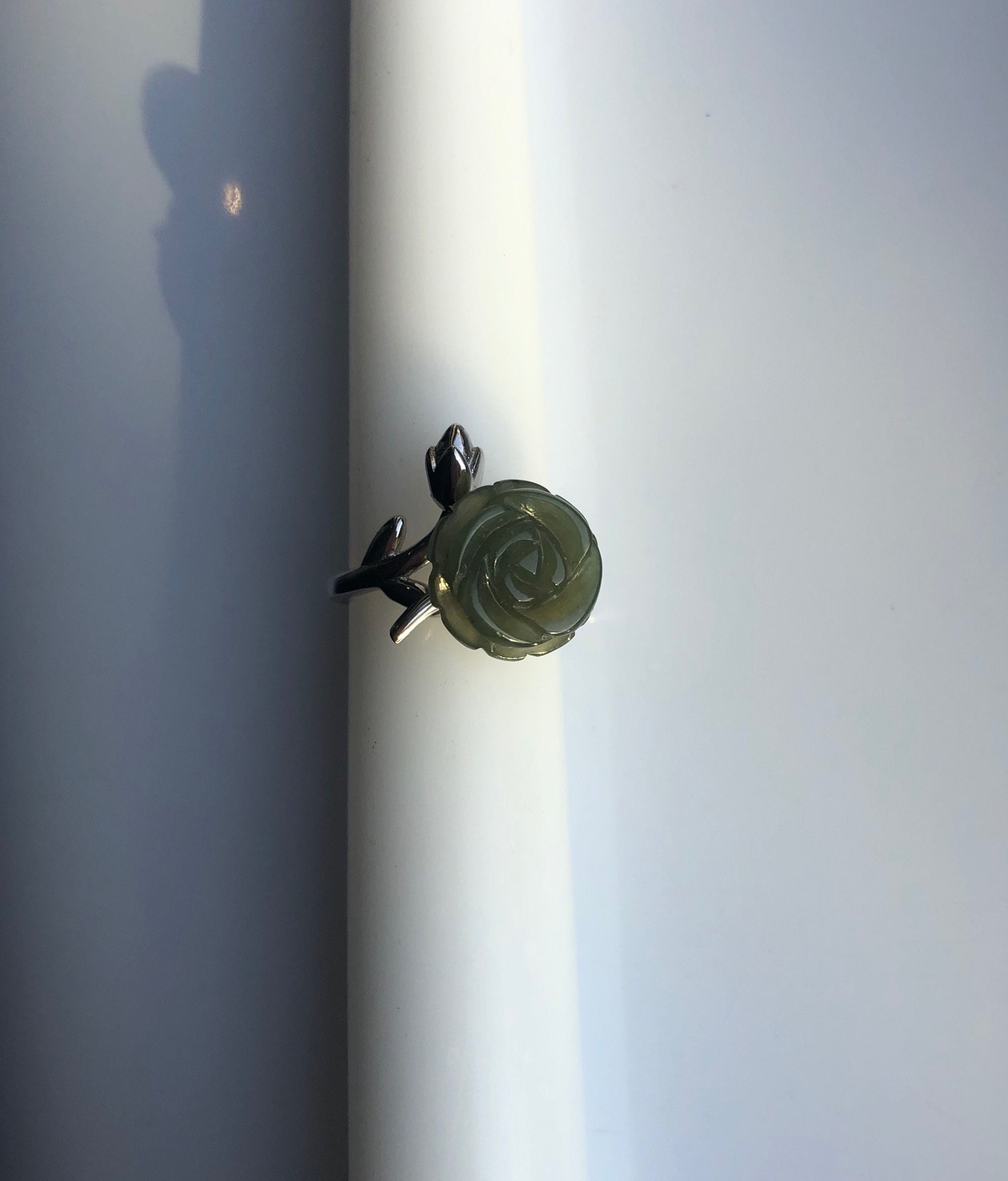 Green jade rose ring with silver leaf band – front view