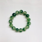 Front view of green moss agate jade bracelet made with stretchable natural jade beads