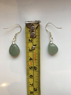the jade earrings measured by a tape
