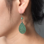 Model wearing vintage lace silver light green jade teardrop earrings