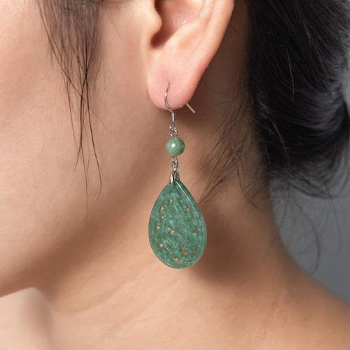 Model wearing vintage lace silver light green jade teardrop earrings