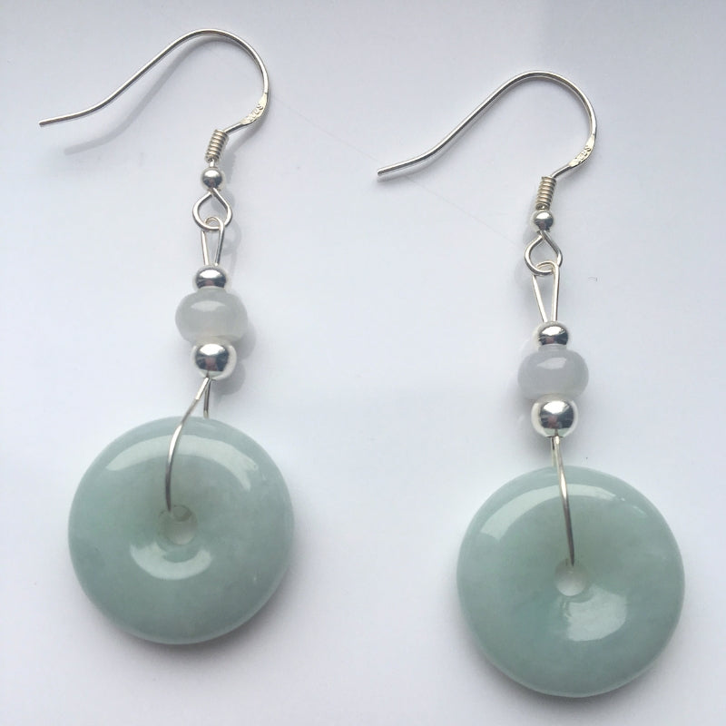 Sage green jade donut earrings in sterling silver dangle style, front view