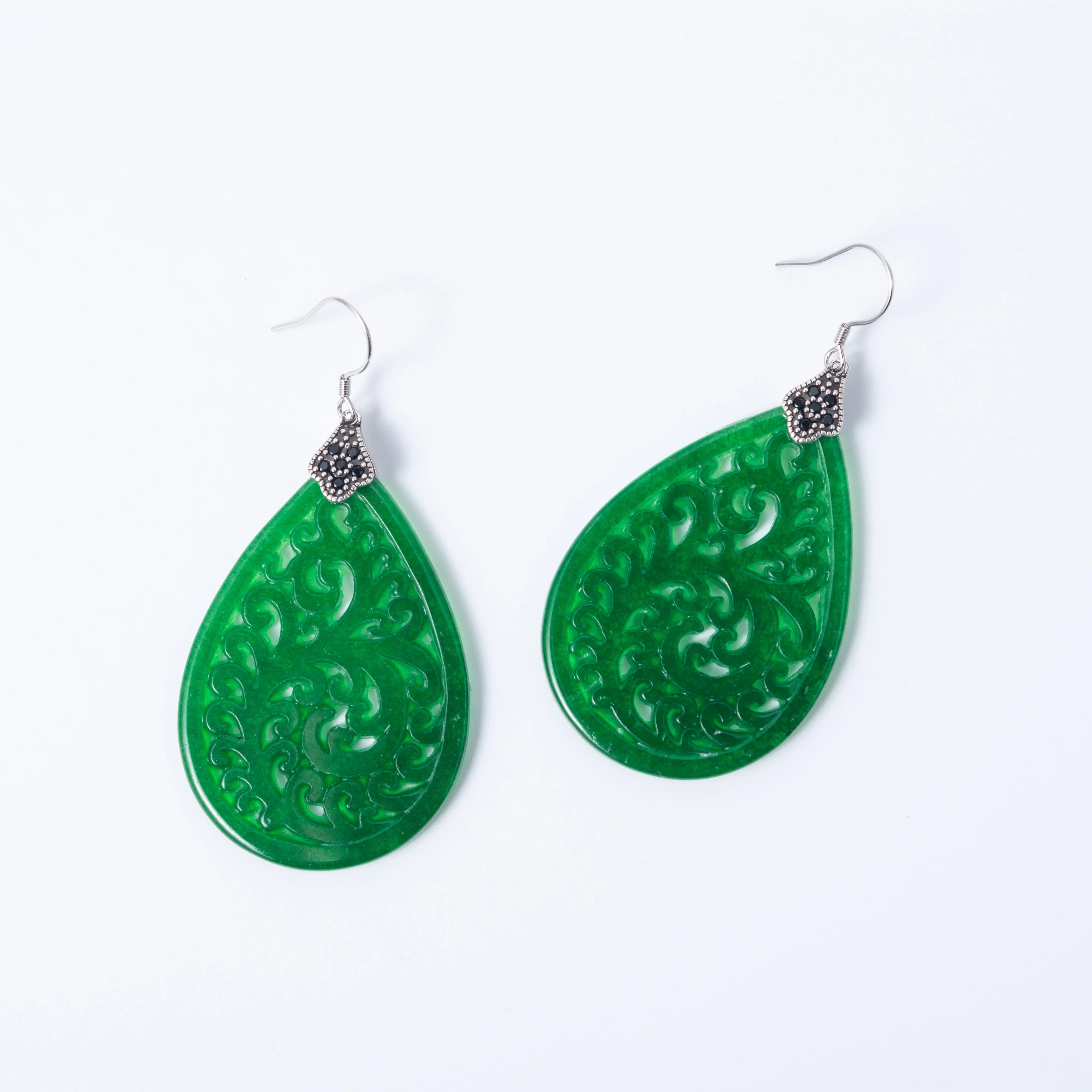 Vintage lace design jade earrings featuring teardrop emerald green jade and silver filigree details