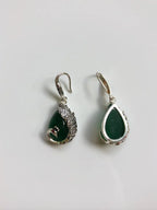 Back view showing smooth jade stone and silver setting