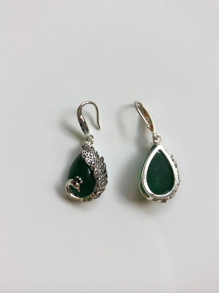 Back view showing smooth jade stone and silver setting
