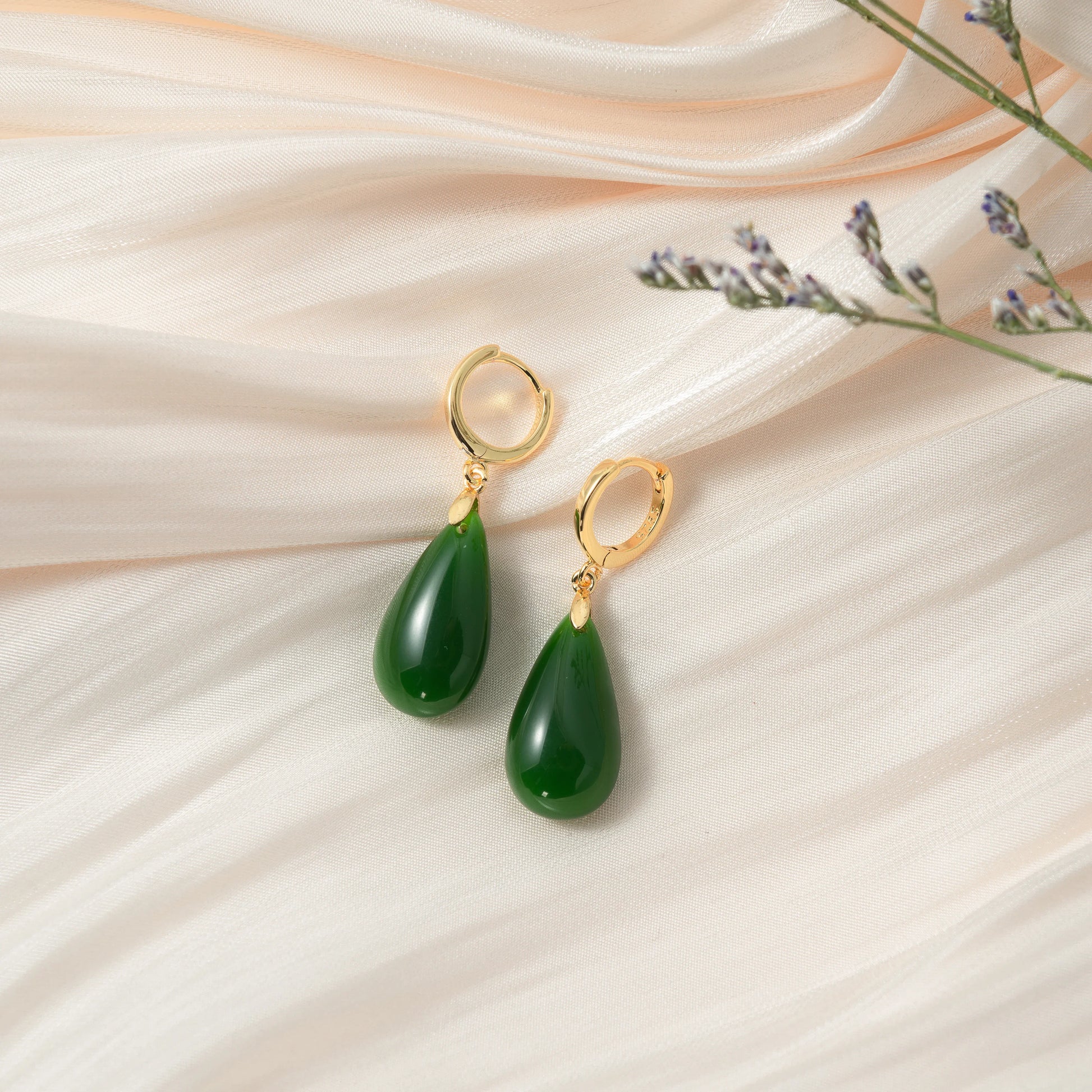 Vintage teardrop jade earrings handcrafted with 14k gold and natural Chinese jade in silk background