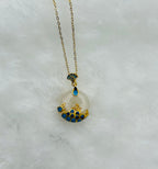 Side angle of jade pendant necklace showing thickness and ceramic glaze