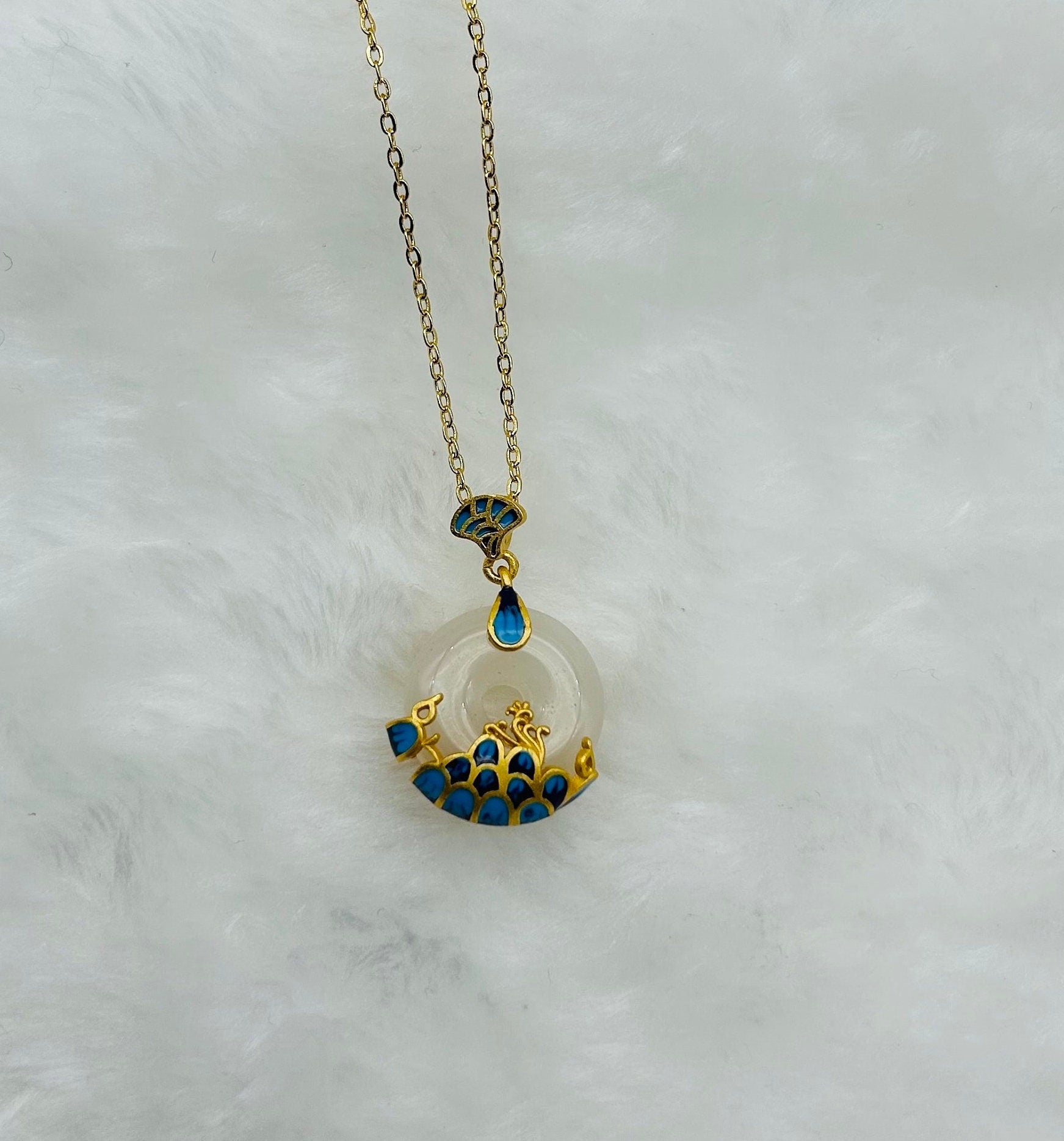 Side angle of jade pendant necklace showing thickness and ceramic glaze