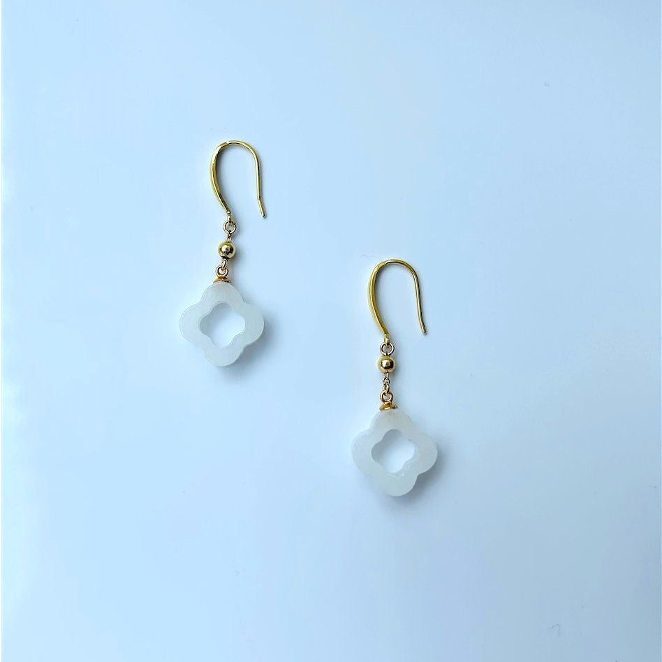 Front view of white jade clover earrings with gold-plated hooks and polished finish
