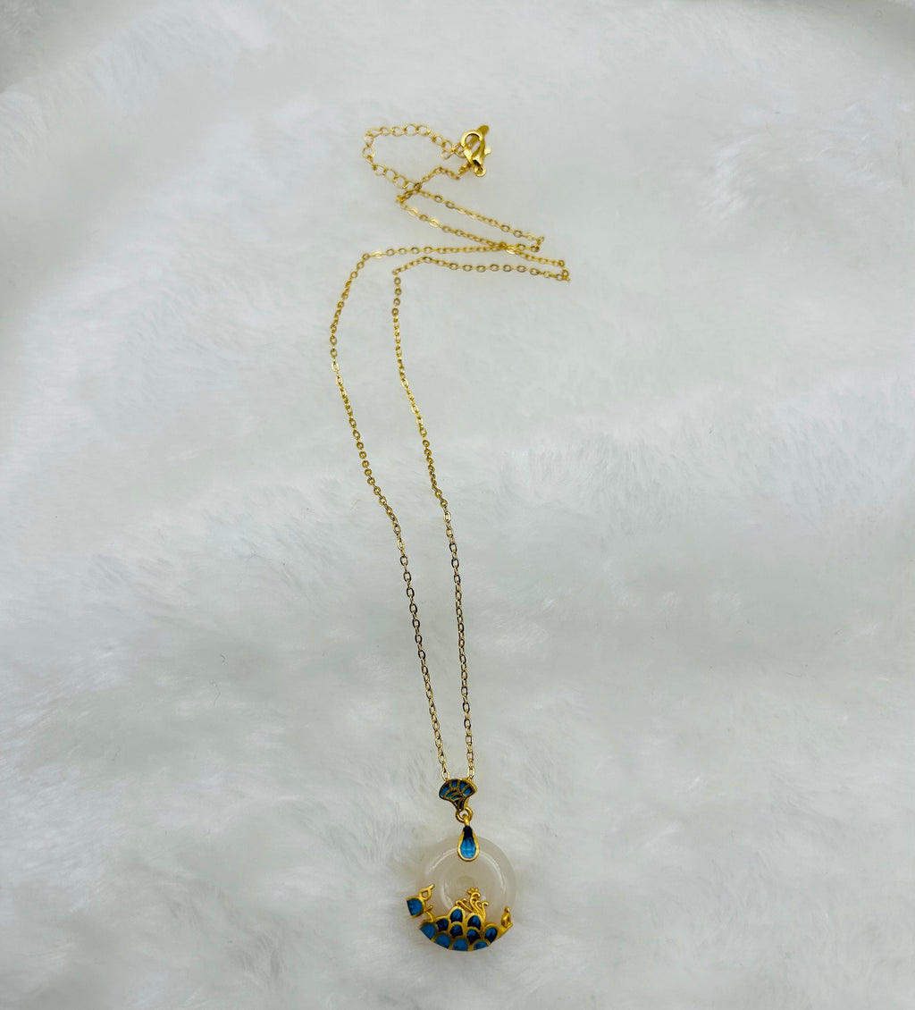 White jade ocean circle necklace displayed in elegant and soft cloth