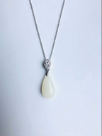 White jade pendant necklace with silver setting, modern and minimalist design