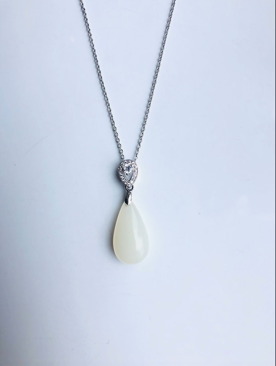 White jade pendant necklace with silver setting, modern and minimalist design