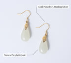 Gold-plated 925 sterling silver earrings with natural nephrite jade stones on a light gray background.